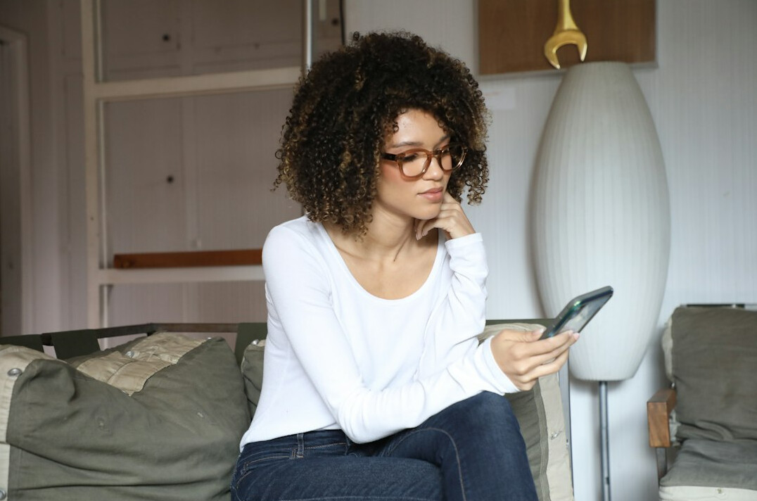 woman checking phone messages
