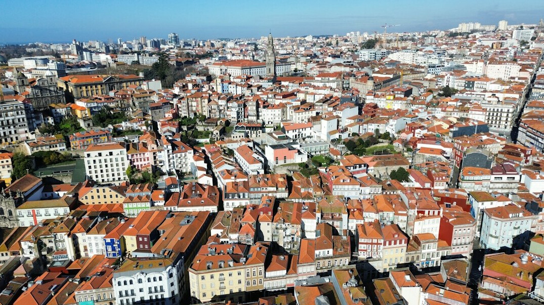 Aerial view of dense residential rooftops in a Portuguese city